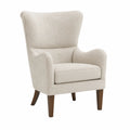 Poltrona in tessuto beige con gambe in legno massello